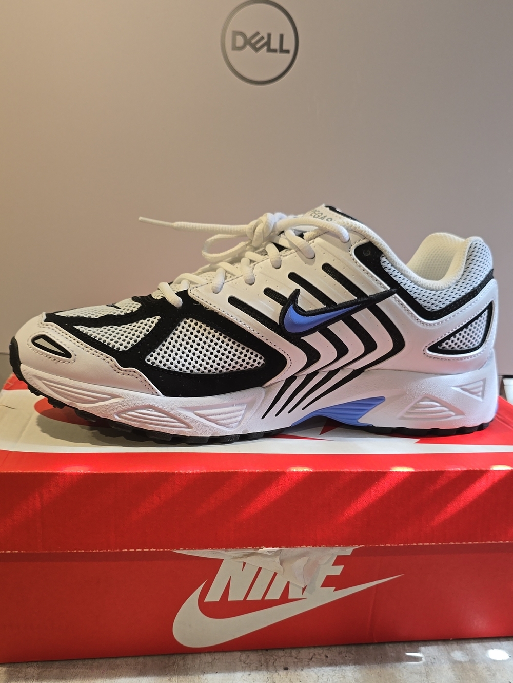 Nike White and Black Athletic Sneaker with Blue Swoosh